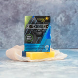 Pheromone men soap with packaging on a textured surface